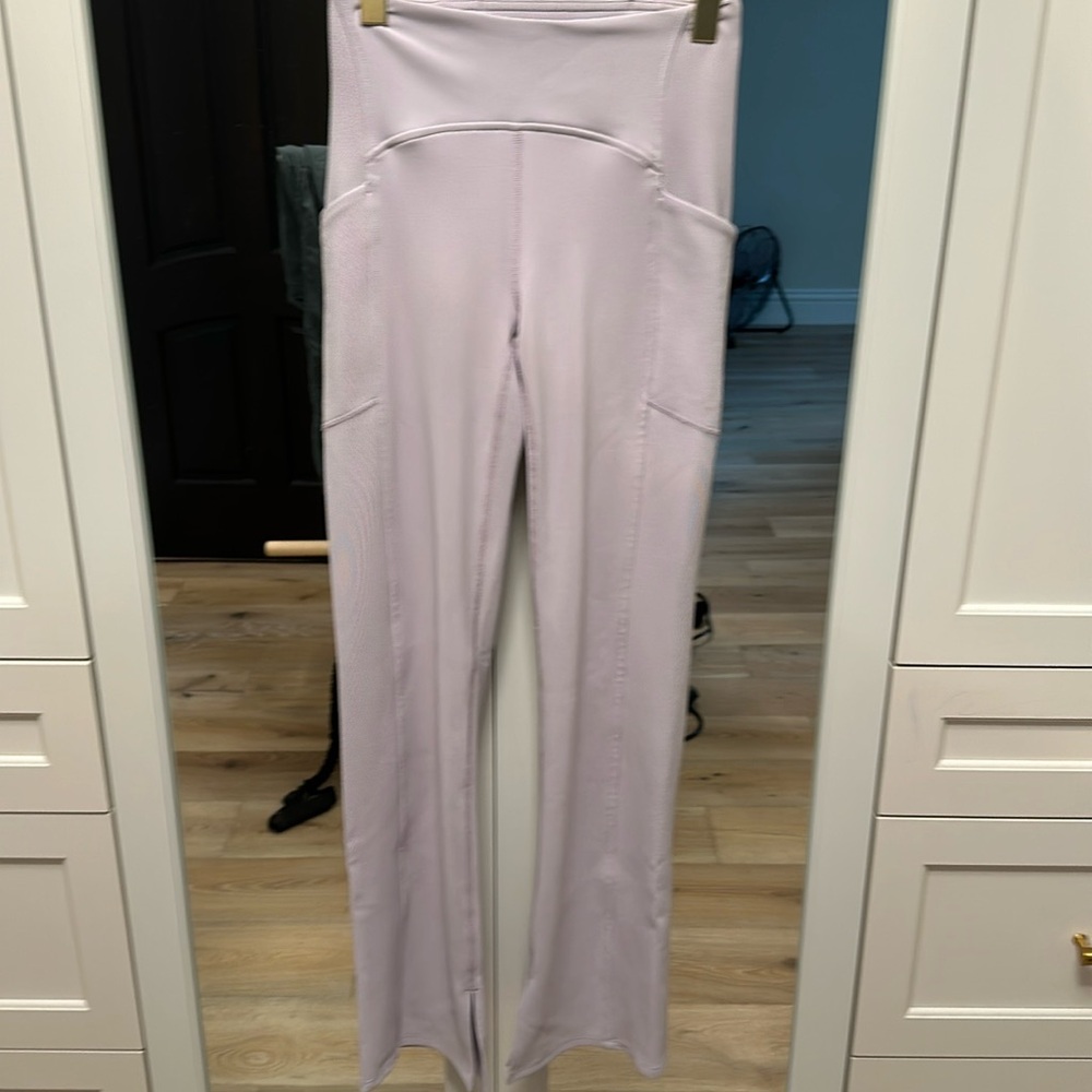 Zella small lavender boot cut, yoga pants with pockets, slits at the bottom.